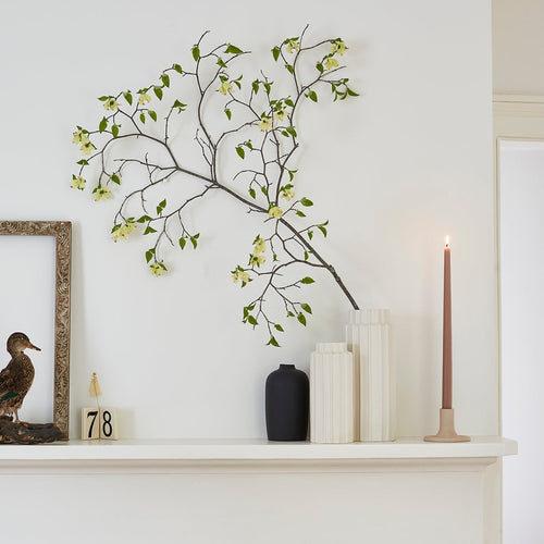 white ceramic cylinder vase