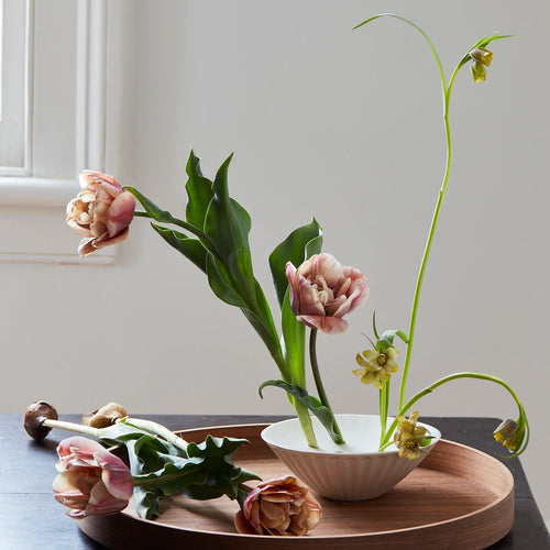 White ceramic pleated flower frog vase