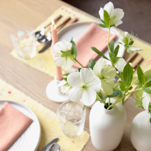 The No. 3 Botanical Placemat & Napkin Set features perfectly paired, handmade, botanically dyed linen napkins and placemats to add to your seasonal table. The placemats are dyed with leftover ranunculus from our floral studio, Poppies & Poses, and cochineal. Napkins are dyed with quebracho rojo. Pair with your favorite Floral Society candles and holders for a complete tablescape.  Set includes 4 placemats & 4 napkins. 