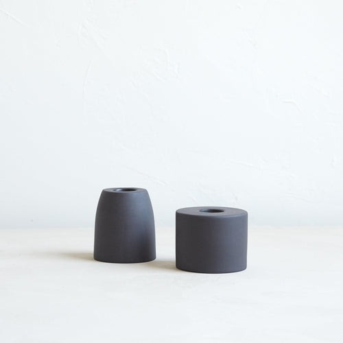 The petite ceramic taper holders complement our taper candles with their matte finish and modern form-a bold collection perfect for everyday use or entertaining. Each holder is sized to fit a standard taper candle.