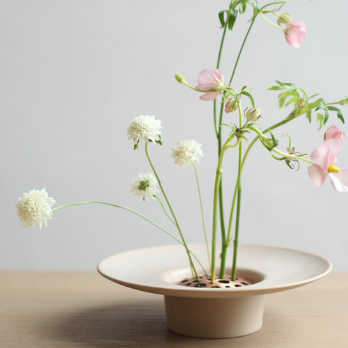 Our handcrafted Copper Flower Frogs are an aesthetically considered take on a utilitarian design mechanic. Used to space stems out and hold them in place, they pair perfectly with our Ceramic Cylinder Vase and the Ikebana Vase. Pure copper, they will patina gracefully over time.