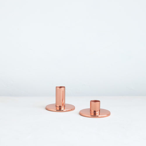 The perfect companion to our taper candle collection, our copper taper holders are a sleek, modern way to add a lustrous accent to any space. Each copper plated holder is sized to fit a standard taper candle.