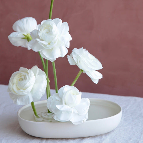 Our Japanese ceramic ring flower frogs are handmade in Japan using ceramic powder. Used for ikebana flower displays, these flower frogs are a sustainable, reusable alternative to floral foam.  Use as a set or as individual flower frogs depending on your design and floral material. The ceramic material keeps the water clean in your vase adding to the longevity of your flowers. 