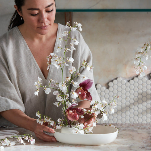 Our stand-alone ceramic frog is perfectly paired with the oval dish. It can also be used independently or with any open vessel of your choosing. The holes can be filled with water to display a minimal selection of flowers, or keep herbs fresh on your kitchen counter. When not in use, display it as a sculptural object. 