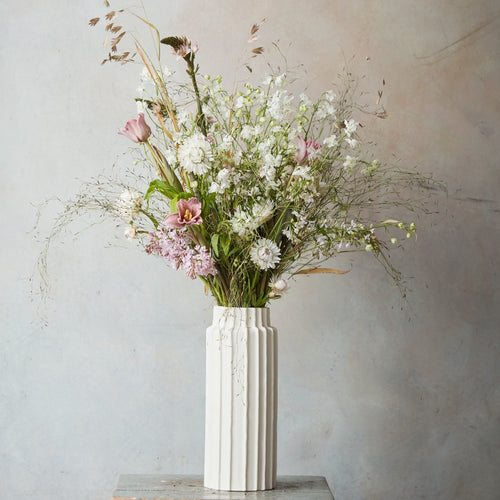 Our ceramic cylinder vases invite you to reconnect with the wild bounty of nature, providing the perfect vessels for a foraged handful or a farmer’s market bunch. Inspired by organic linear forms found in nature, use them for impromptu and loose arrangements or for displaying dried botanicals through the colder months.