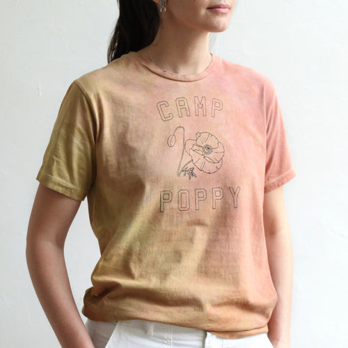 We collaborated with our friend, Anne-Marie, of Pirtti, to naturally dye our flower camp t-shirts using her signature plant dying process. Each t-shirt in this limited edition run is bound with string before being submerged in the dye bath. The color must seek out the fabric to adhere to it, resulting in an organic pattern of color that ebbs and flows in depth.