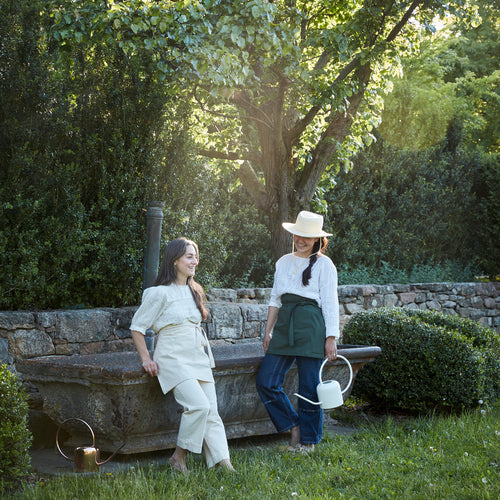 Our pure cotton half apron is both stylish and utilitarian, and designed to fit most body types. Featuring wide side and front pockets, it is ideal for working in the garden, kitchen, or studio. Each apron is soft-washed for added comfort. Azo-free dye.  Dimensions: 17” W x 25” H with elongated waist ties